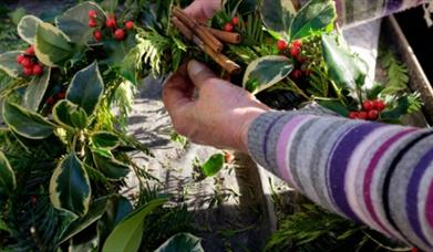 image of a Christmas wreath being made