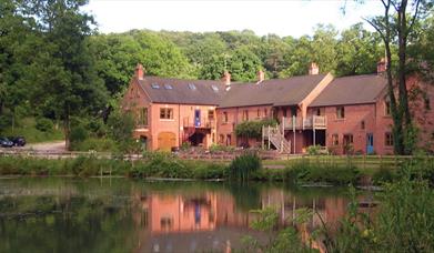 View across the lake to Foxtwood Cottages