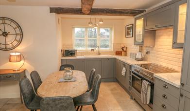 The rustic kitchen/dining area at Orchard Barn