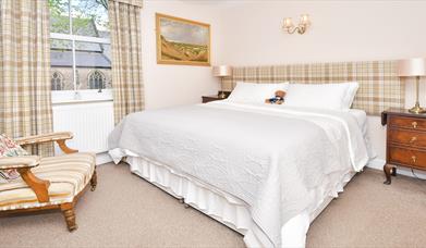The comfortable bed and furnishings in Room 1 of The Fountain Inn, Leek, Staffordshire
