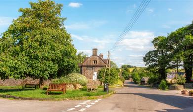 Wetton Village centre with wooden benches