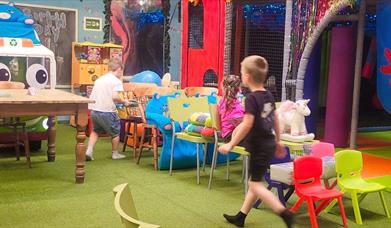 Children at play with interactive indoor soft play toys