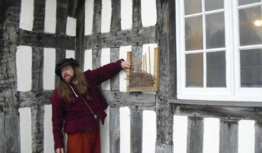 A costumed performer at Ford Green Hall, Staffordshire