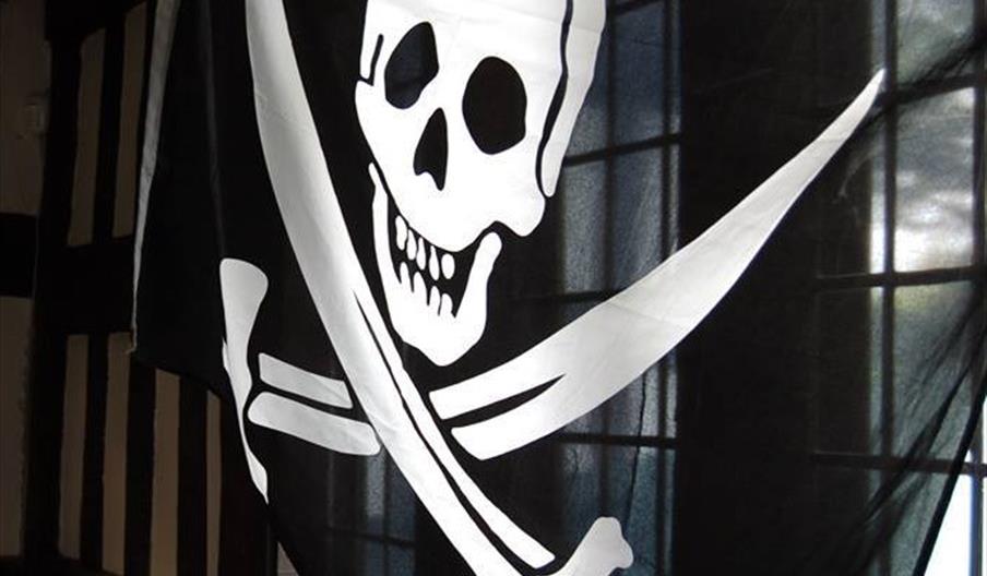 photo of a Pirate flag, a black background with a skull and two crossed swords