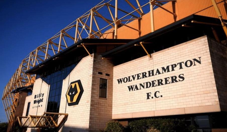 Image shows the entrance to Wolverhampton Wanderers' Molineux Stadium, on a sunny day
