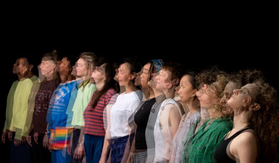 A slightly blurred image of the choir singing
