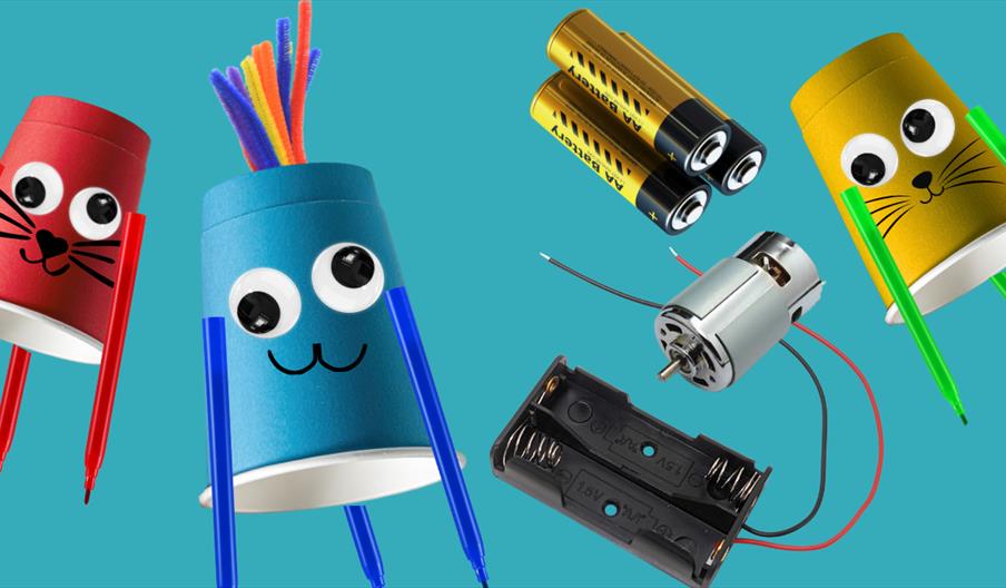 three paper cups with googly eyes, with batteries and a power pack