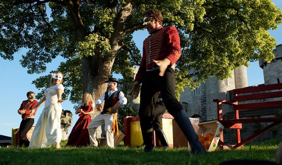 The Much Ado About Nothing cast performs in the open-air