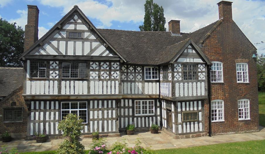 An image of an old Tudor building on a sunny day