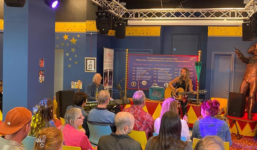 People enjoying a talk at the Philip Astley Centre