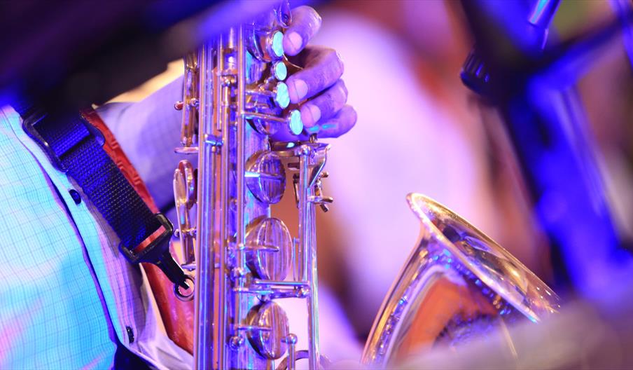 A close up of a golden saxophone