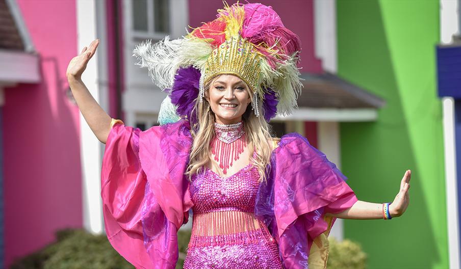 Colourfully dressed dancer at Alton Towers Mardi Gras