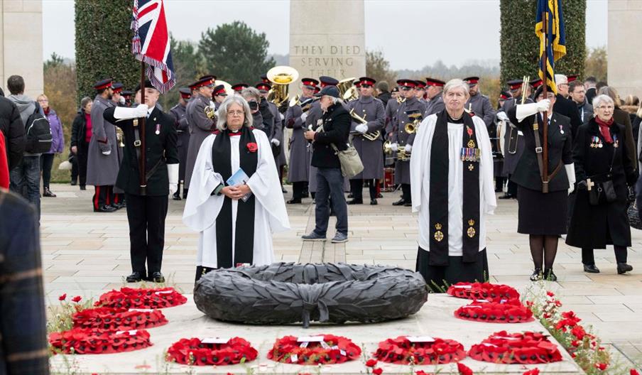 people in reflection at a time of remembrance