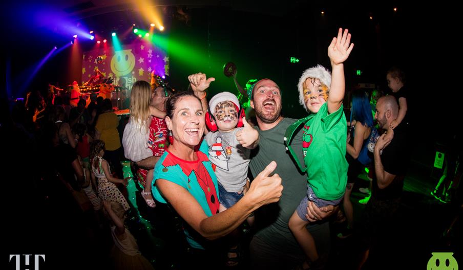 A family enjoys the music at the Family Rave, Staffordshire
