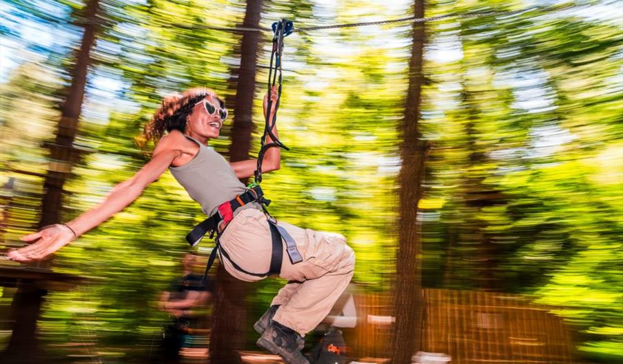 Woman  on zipline at Go Ape