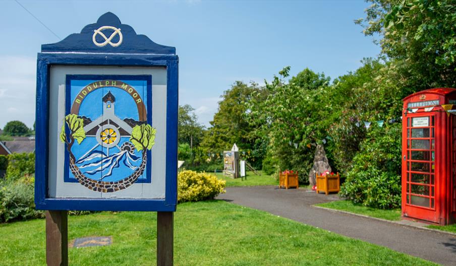 Biddulph Moor village green, with village sign and red telephone box