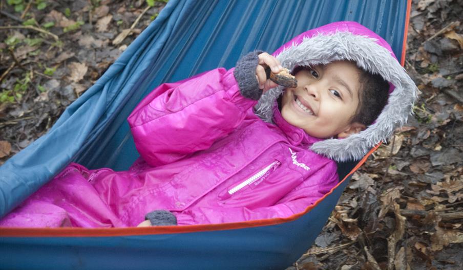 A young visitor relaxes in a hammock
