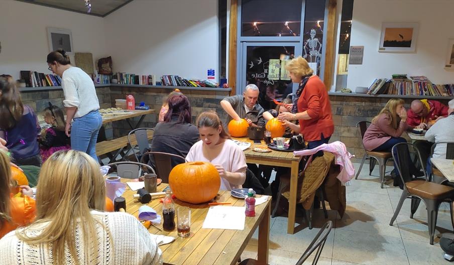 image of a group of people carving pumpkins