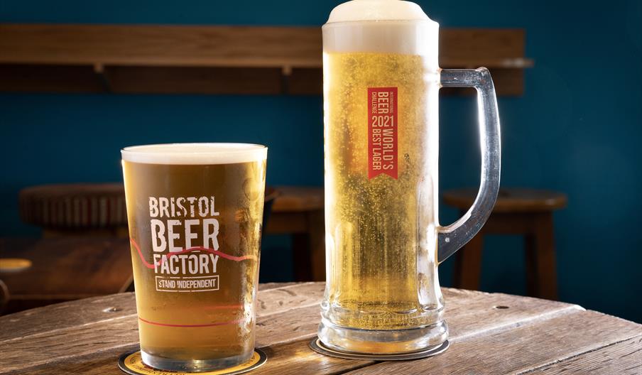 image depicts a two glasses of ale