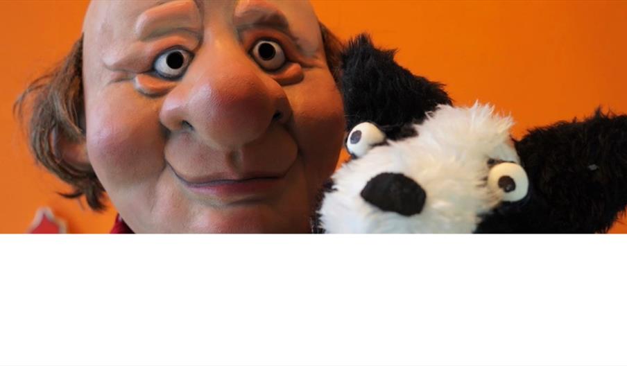 image of puppet man and dog