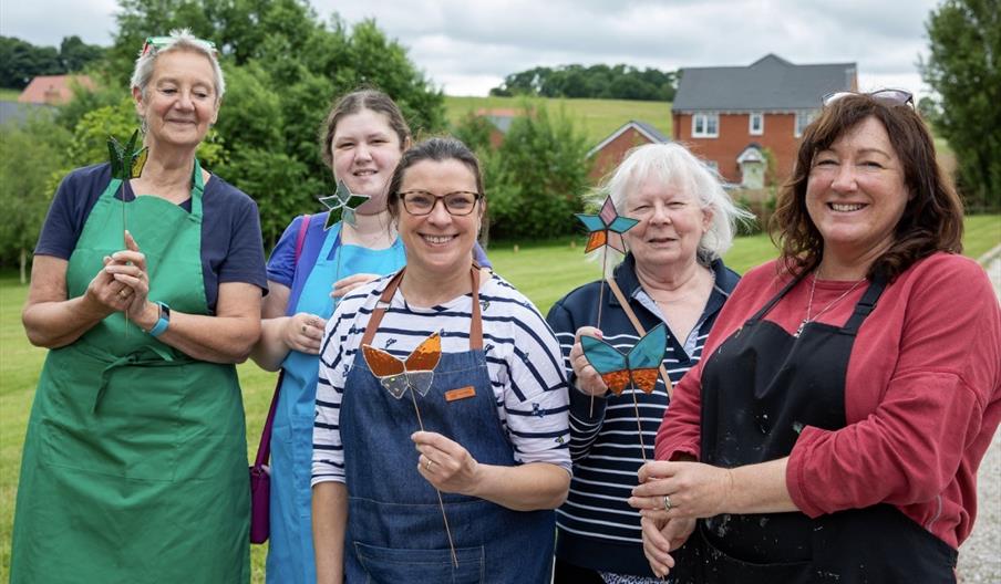 Group of students with completed stained glass