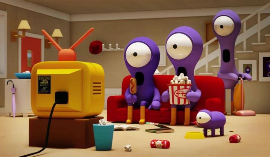 image of cartoon aliens watching TV