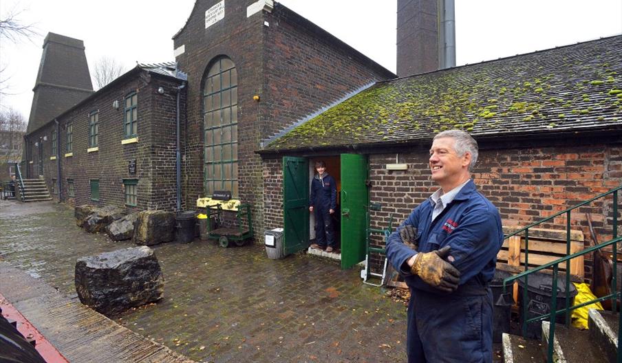 Image shows two of the volunteers at the Etruria Industrial Museum on a wet, grey day