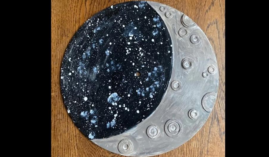 image of vinyl record made into a moon