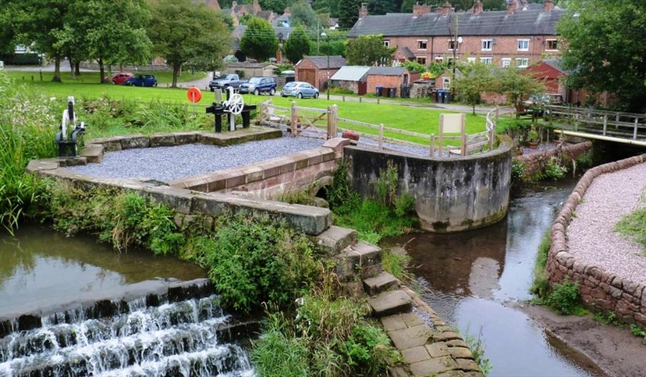The River Churnet and weir in the village of Oakamoor
