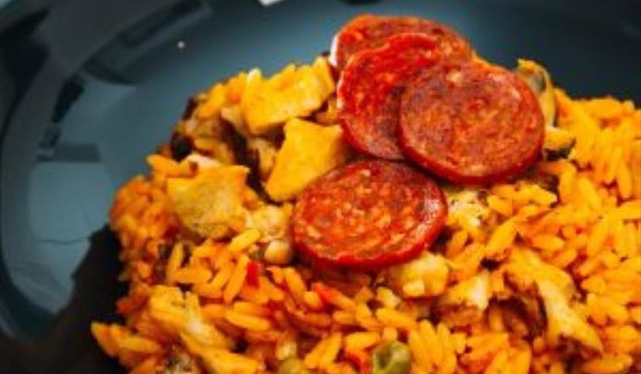 Image shows a tasty-looking paella, ready to eat