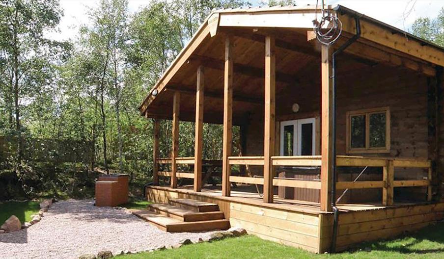 Stay in one of the timber lodges at Quarry Walk Park