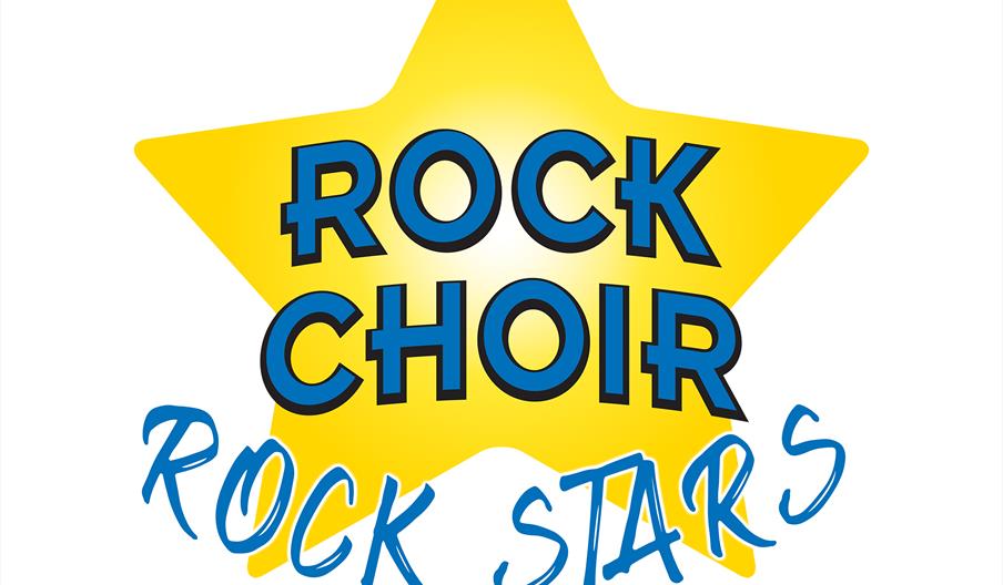 Image is a graphic saying Rock Choir Rock Stars, on a yellow star, against a white background