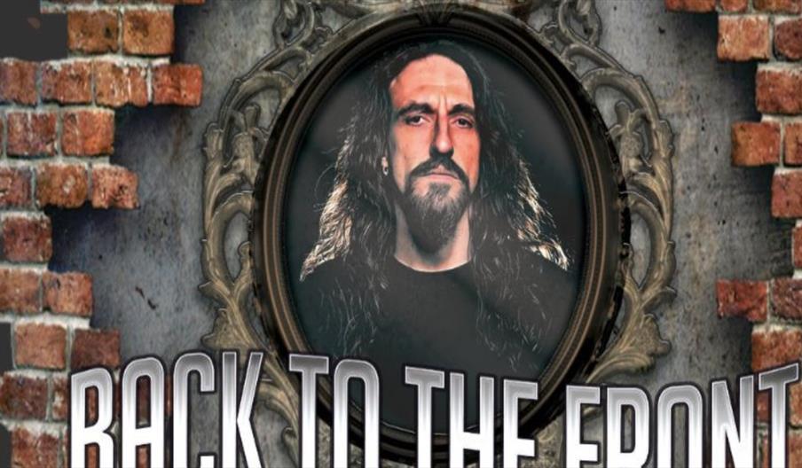 image of Steve Hughes in a mirror on a brick wall
