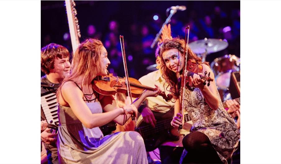 image shows two female violinists