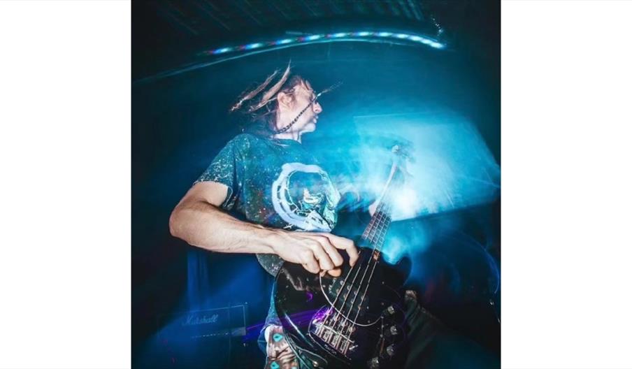 image of Dread Lagoon playing guitar