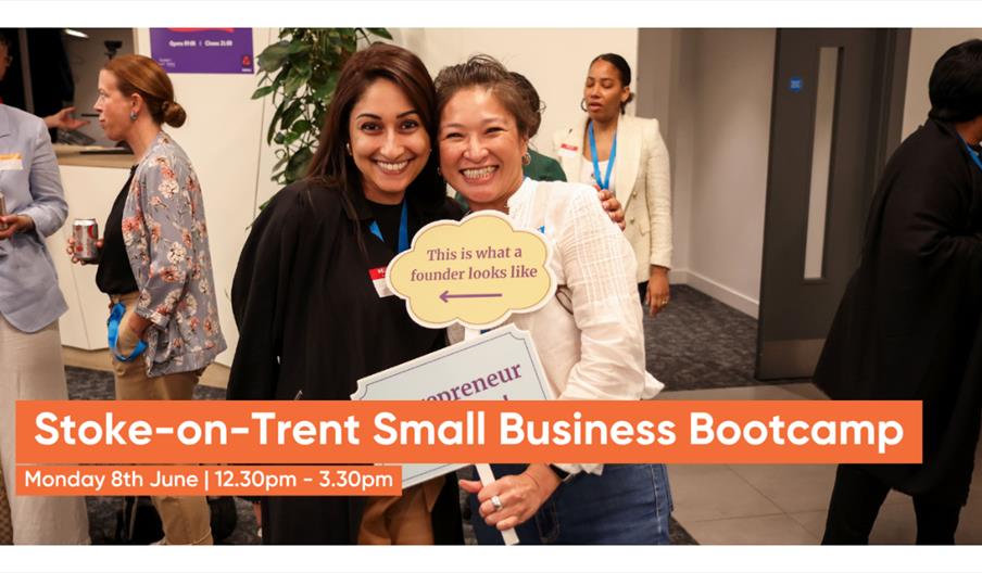 Two people at a networking event hold a sign reading “This is what a founder looks like,” with a banner promoting the Stoke-on-Trent Small Business Bo