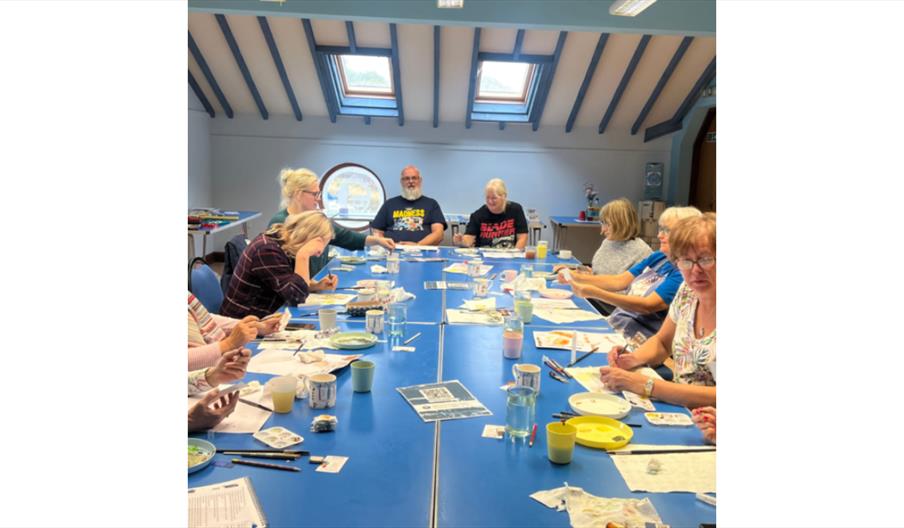 Group of people creating paintings