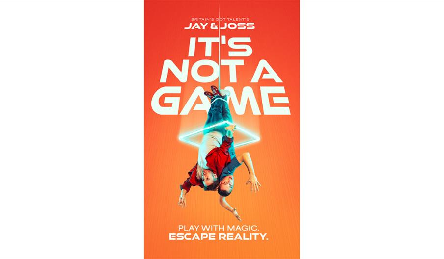 Promotional poster for Jay & Joss's "It's Not a Game" magic show, featuring two illusionists suspended upside down within a glowing geometric shape ag