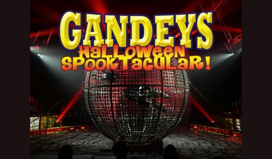 Poster for Gandeys Halloween Spooktacular featuring motorcycle riders inside a large metal globe under dramatic red and white circus lights.