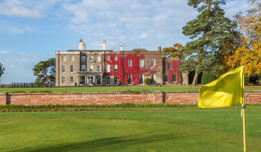 The putting green at Wychnor Park, with the house in the background