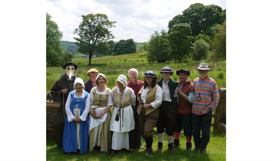 a group of people dressed in Tudor Costume