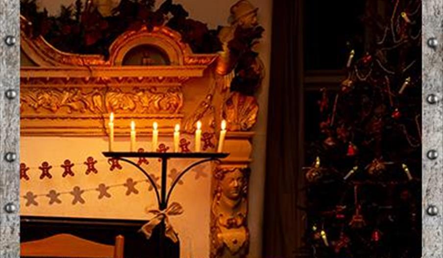Candlelight next to a fireplace