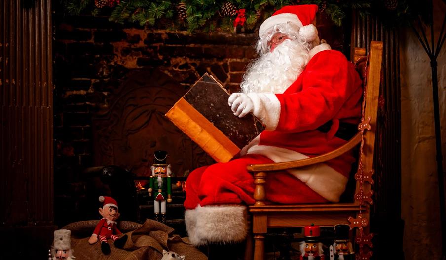 Santa reading a book