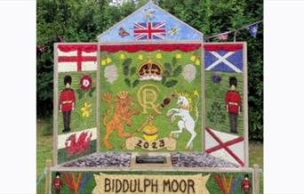 image of a floral artwork surrounding a village well