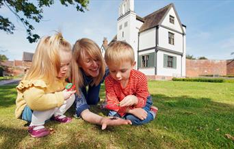 Family exploring the grounds of Boscobel House, South Staffordshire.
