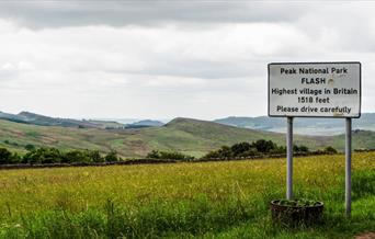 village sign, stating Flash is the highest village in Britain