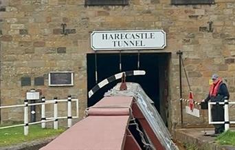 A narrowboat heads into a tunnel