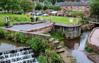 The River Churnet and weir in the village of Oakamoor