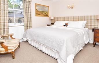 The comfortable bed and furnishings in Room 1 of The Fountain Inn, Leek, Staffordshire