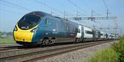 Pendolino Train on Tracks showing Avanti West Coast Logo